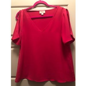 Pink short sleeve top.